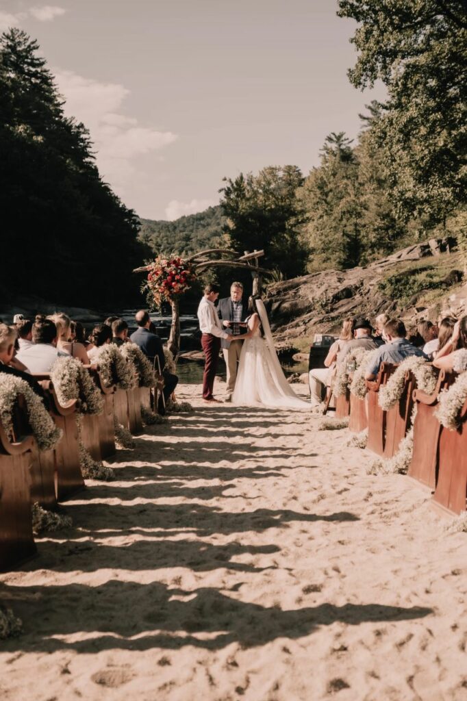 Jonny and Meadow seal their vows in a Christ-centered ceremony by the riverside in North Carolina.