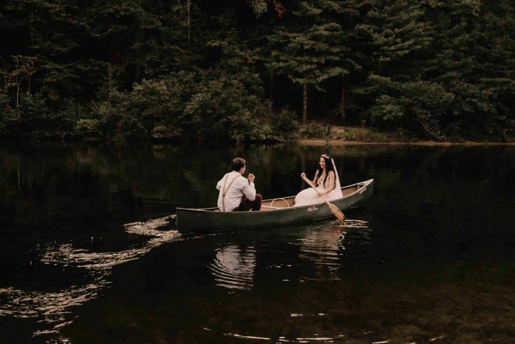 Riverside adventure: Canoeing at Brown Mountain Beach Resort for a unique wedding experience.