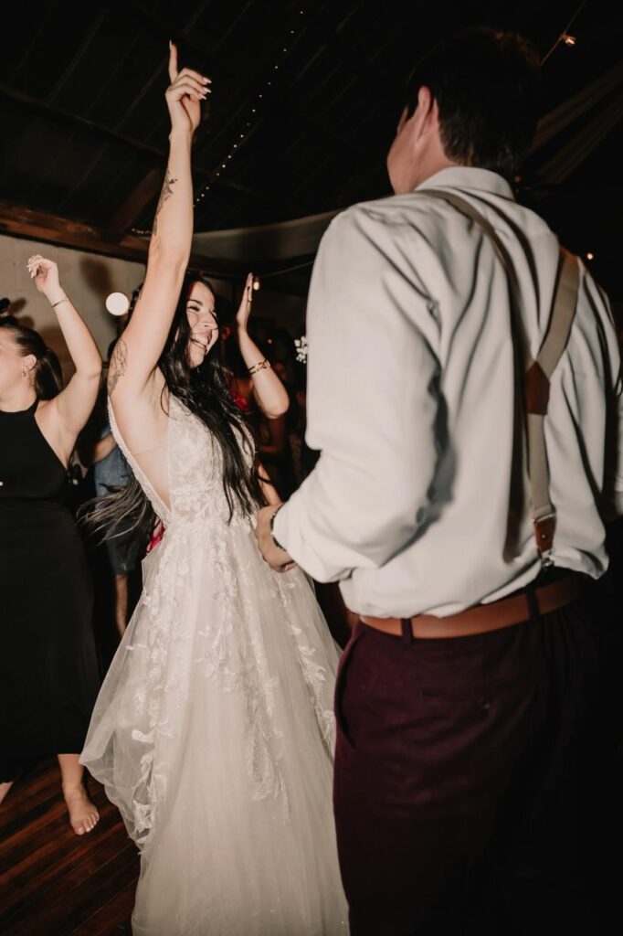 Capturing the magic of a choreographed first dance with spins, dips, and lifts at a picturesque wedding