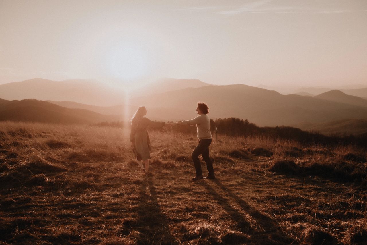 Best Places to Elope in North Carolina - Couple Dancing as the sun sets at Max Patch