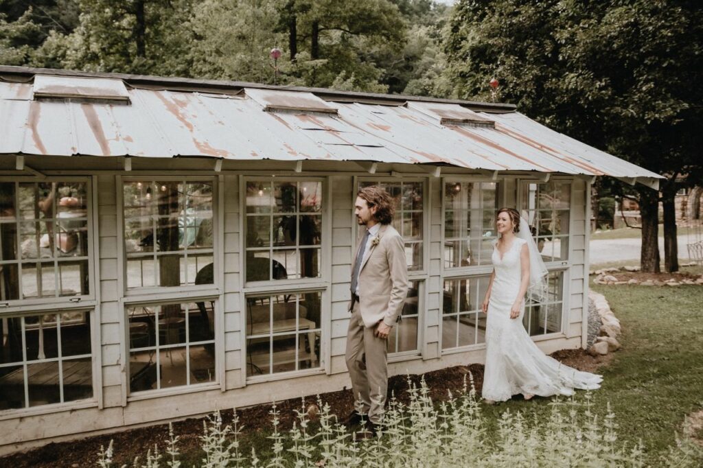First Look in Front of Greenhouse, bride approaching groom
