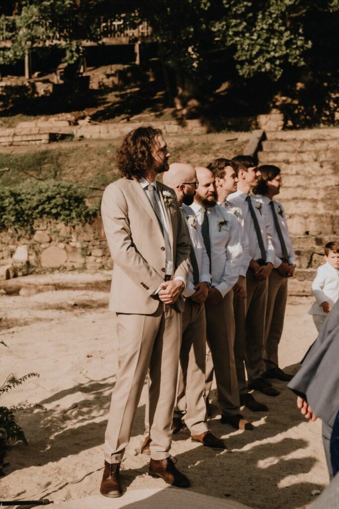 groom waiting for bride to walk down the aisle at a mountain wedding in north carolina