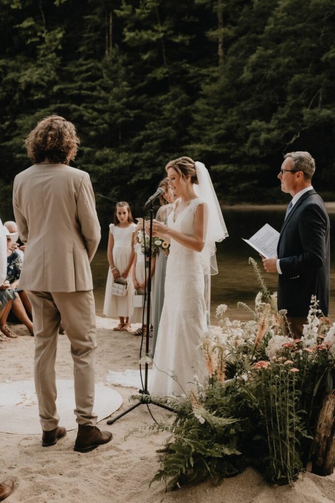 bride reading vows to groom at a mountain wedding in north carolina at brown mountain beach resort
