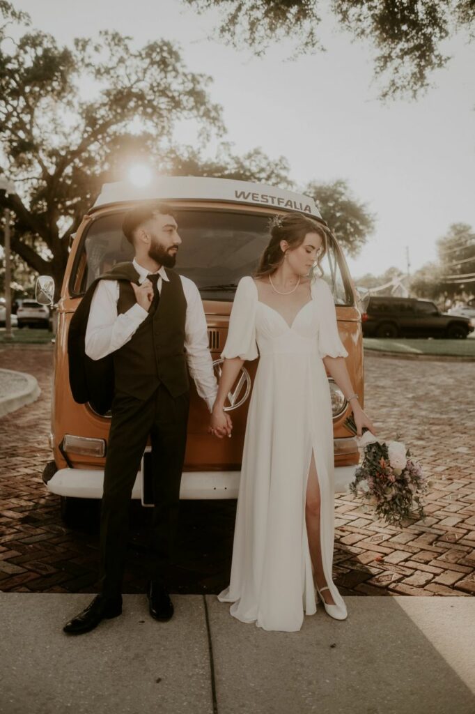 Charming wedding portraits featuring the couple and a whimsical Vintage Westfalia Volkswagen bus