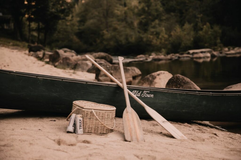 canoe, basket and ores on the beach at Brown Mountain Beach Resort