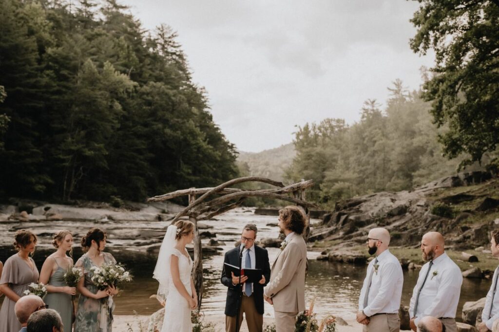 bride and groom exchanging vows during wedding ceremony at Brown Mountain Beach Resort