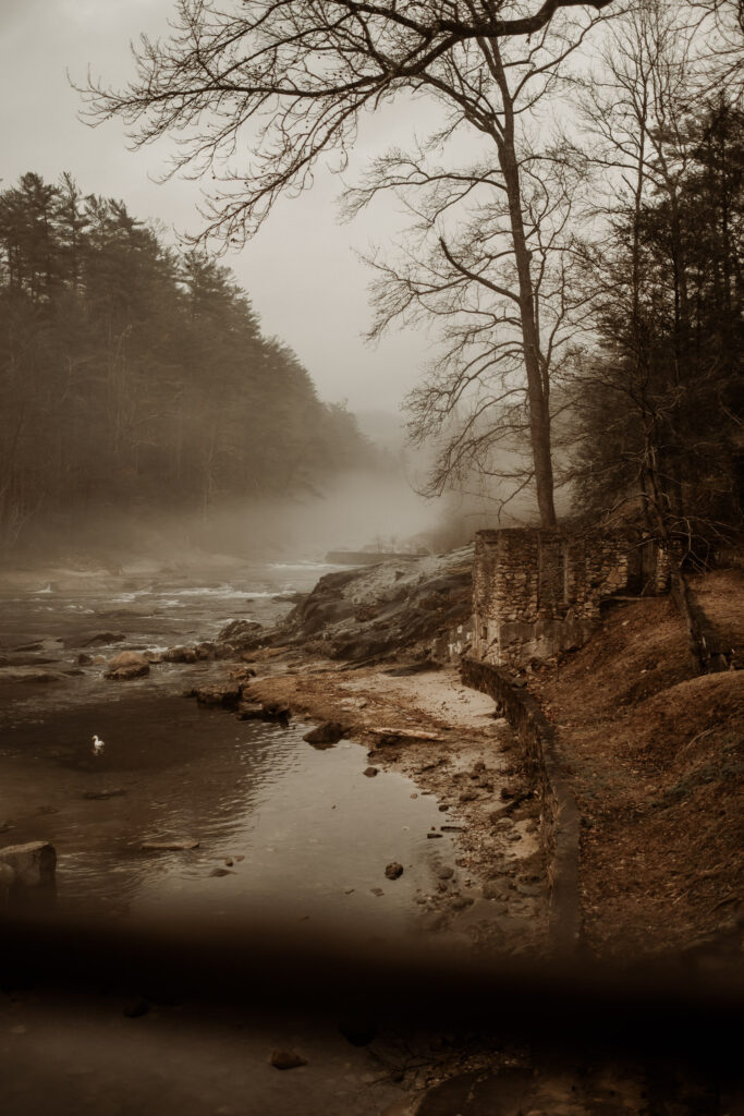 Foggy scene showing river and mountains at Brown Mountain Beach Resort