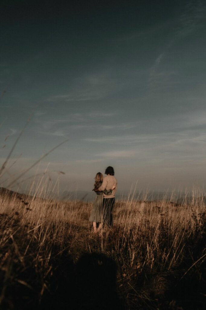 couple looking at the mountains at their Max Patch engagement photos