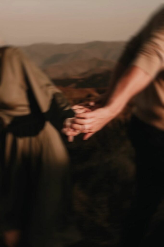 couple holding hands at their Max Patch engagement photos